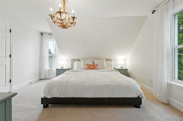6830 Lamar St, Arvada, CO 80003 - bedroom featuring light colored carpet, a chandelier, multiple windows, and baseboards