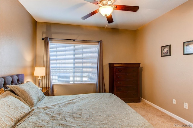 bedroom with carpet flooring, ceiling fan, and baseboards