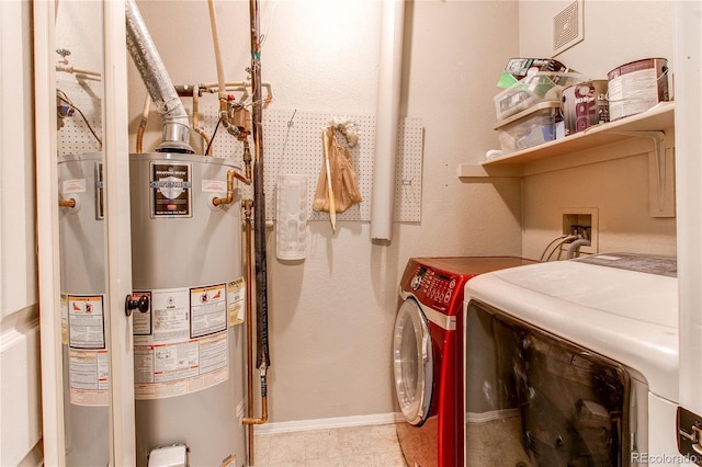 laundry room featuring laundry area, baseboards, visible vents, independent washer and dryer, and gas water heater