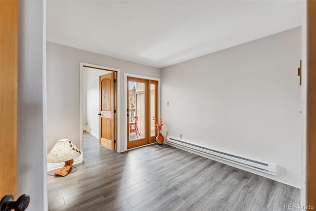 311 W La Bonte St Unit 306, Dillon, CO 80435 - spare room featuring baseboard heating and wood finished floors