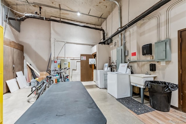 311 W La Bonte St Unit 306, Dillon, CO 80435 - garage featuring washing machine and clothes dryer, electric panel, and a sink