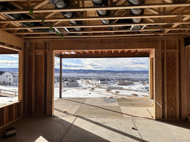 miscellaneous room with a mountain view