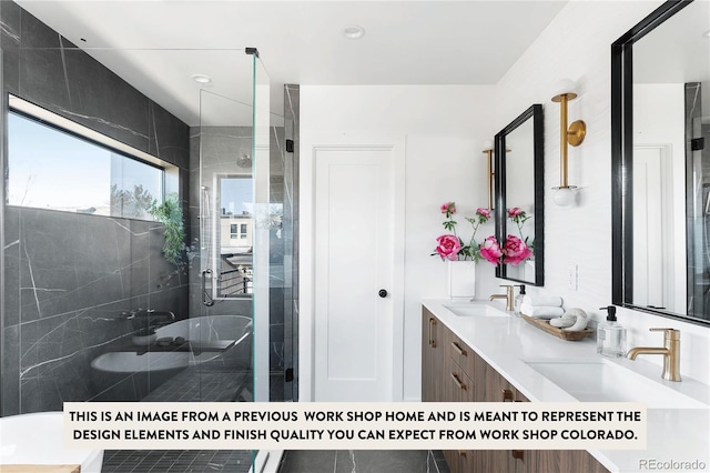 bathroom featuring vanity and a shower with shower door