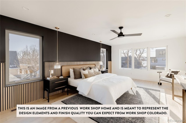 bedroom featuring ceiling fan and light wood-type flooring