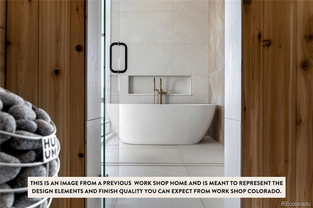 bathroom featuring a bathtub and tile patterned floors