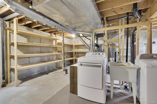 unfinished basement featuring washer and clothes dryer