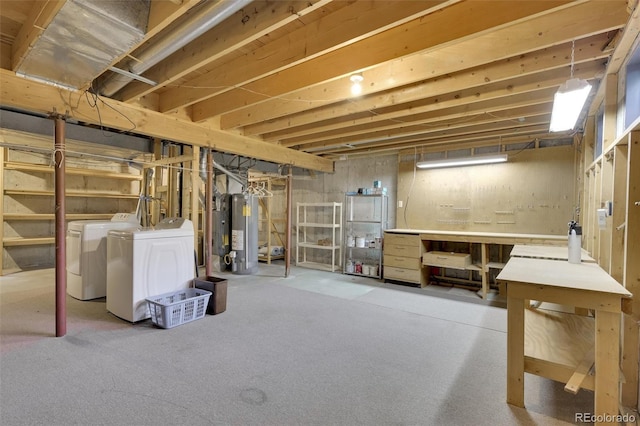 unfinished basement featuring washer and clothes dryer and gas water heater