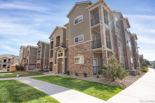 9227 Rolling Way Unit 201, Parker, CO 80134 - view of building exterior featuring central AC