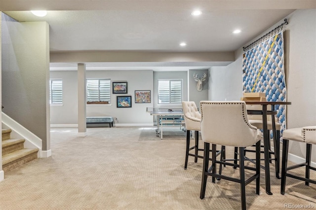 dining area with light colored carpet