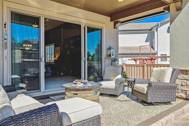 view of patio featuring an outdoor fire pit