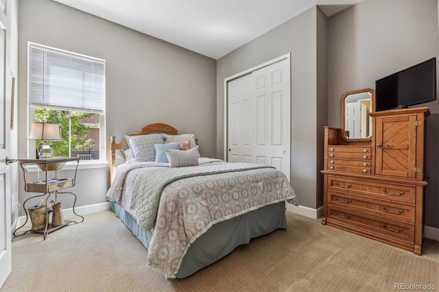 bedroom featuring a closet and carpet