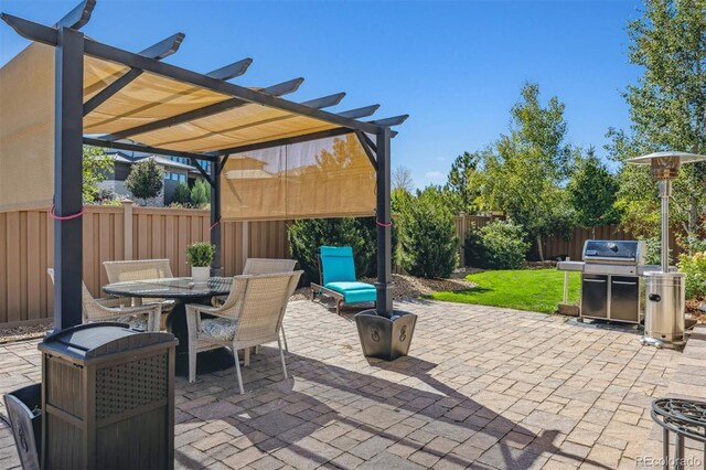 view of patio featuring a pergola and a grill