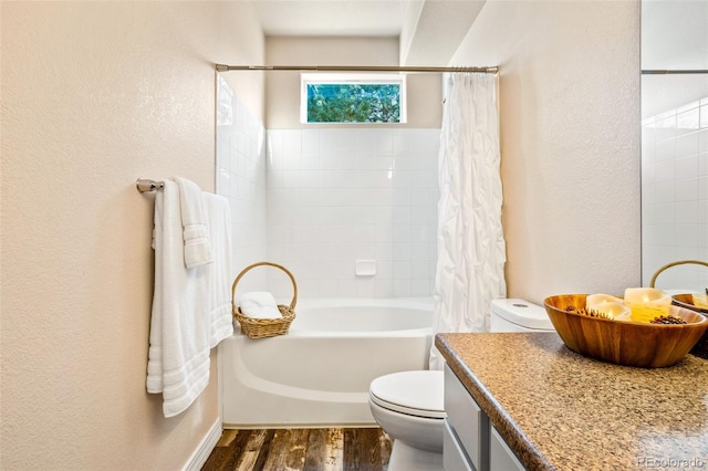 full bathroom featuring vanity, hardwood / wood-style flooring, toilet, and shower / bathtub combination with curtain