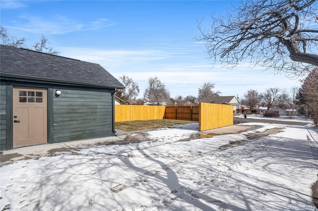 view of yard layered in snow