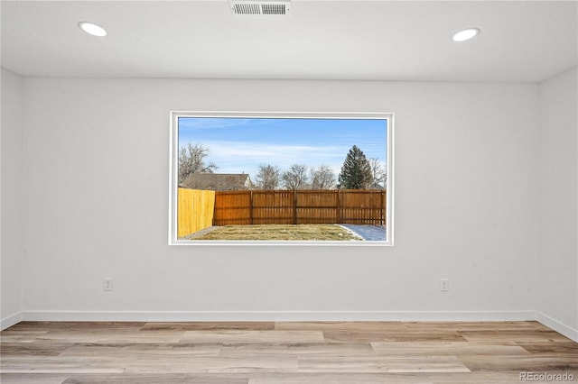 empty room featuring wood-type flooring