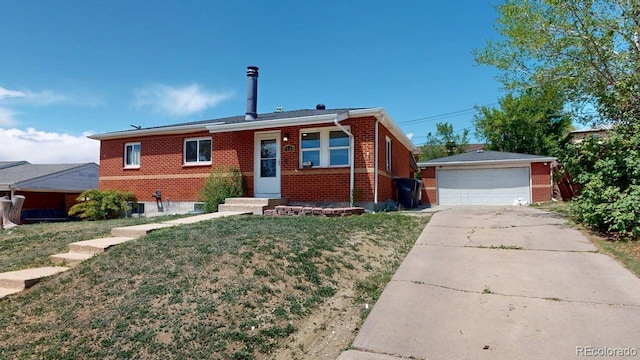 2533 E 90th Pl, Thornton, CO 80229 - view of front of property with a garage, an outbuilding, a front lawn, and brick siding