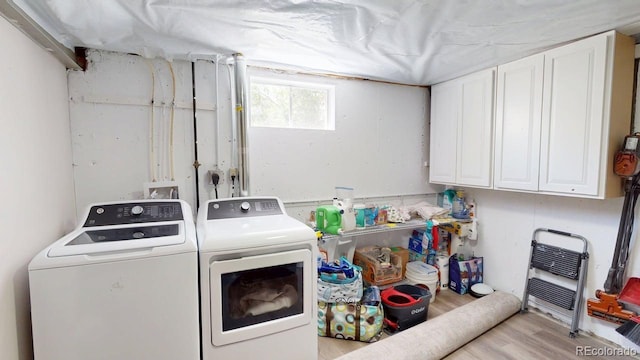 2533 E 90th Pl, Thornton, CO 80229 - clothes washing area featuring cabinet space, washer and clothes dryer, and wood finished floors