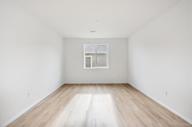 unfurnished room featuring light hardwood / wood-style flooring