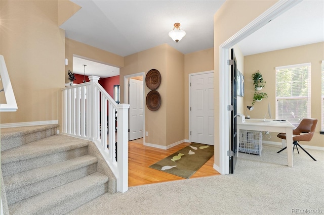 2488 Lake Vista Dr, Broomfield, CO 80023 - carpeted foyer featuring baseboards and stairway