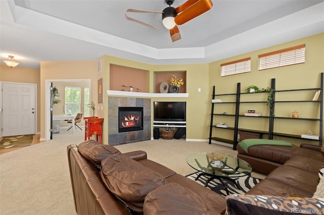 2488 Lake Vista Dr, Broomfield, CO 80023 - living room featuring carpet floors, a raised ceiling, ceiling fan, and a fireplace