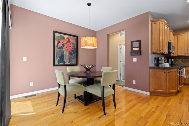 2488 Lake Vista Dr, Broomfield, CO 80023 - dining area featuring light wood-style floors and baseboards