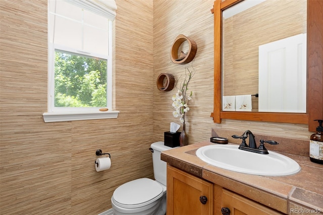 2488 Lake Vista Dr, Broomfield, CO 80023 - half bath featuring vanity and tile walls