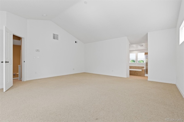 2488 Lake Vista Dr, Broomfield, CO 80023 - spare room with light colored carpet and lofted ceiling