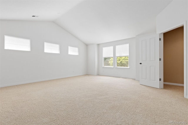 2488 Lake Vista Dr, Broomfield, CO 80023 - unfurnished bedroom featuring light carpet and vaulted ceiling