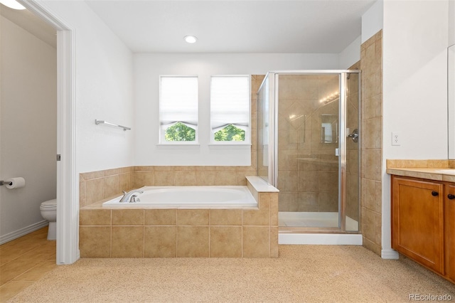 2488 Lake Vista Dr, Broomfield, CO 80023 - full bath featuring a shower stall, a bath, vanity, and tile patterned flooring