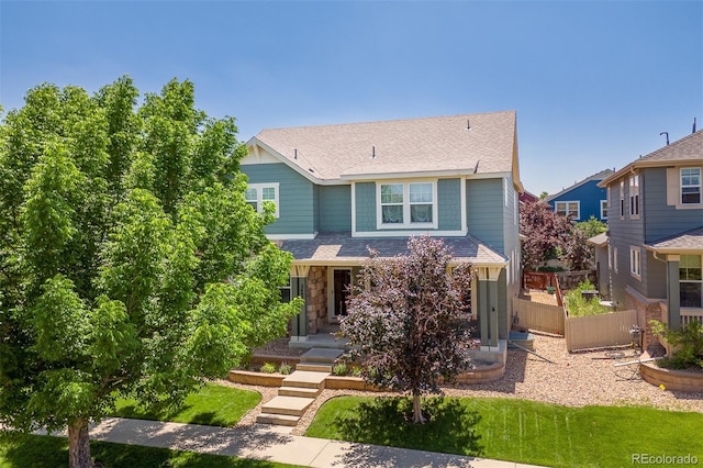 2488 Lake Vista Dr, Broomfield, CO 80023 - view of front facade with stone siding and a shingled roof
