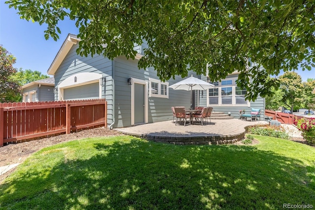 2488 Lake Vista Dr, Broomfield, CO 80023 - back of property featuring a garage and a patio area