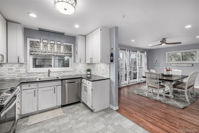 10478 Ogden St, Northglenn, CO 80233 - kitchen featuring stainless steel appliances, a sink, recessed lighting, white cabinetry, and a ceiling fan