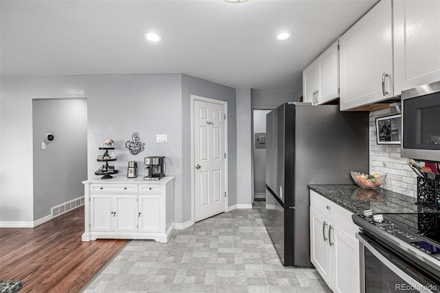 10478 Ogden St, Northglenn, CO 80233 - kitchen featuring white cabinetry, appliances with stainless steel finishes, baseboards, and recessed lighting