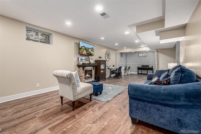 10478 Ogden St, Northglenn, CO 80233 - living room featuring a fireplace, wood finished floors, recessed lighting, and baseboards