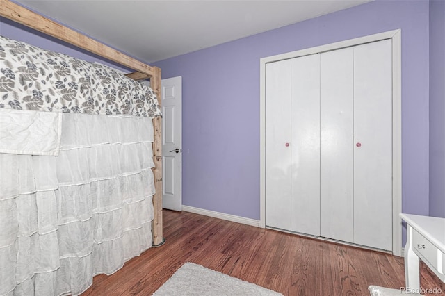 10478 Ogden St, Northglenn, CO 80233 - unfurnished bedroom featuring wood finished floors, a closet, and baseboards