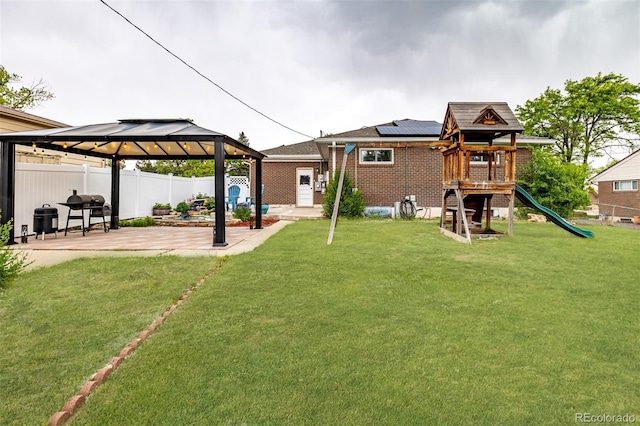 10478 Ogden St, Northglenn, CO 80233 - view of yard with a patio, a gazebo, and a playground