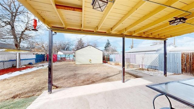 view of patio / terrace with a storage shed