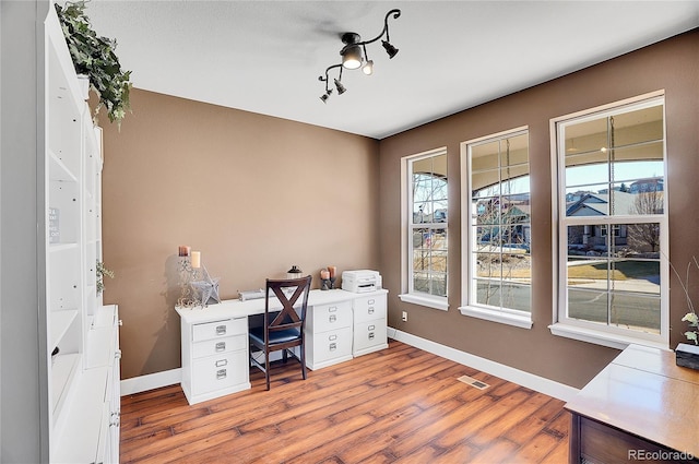 8726 Gardenia Cir, Arvada, CO 80005 - office area featuring wood finished floors and baseboards
