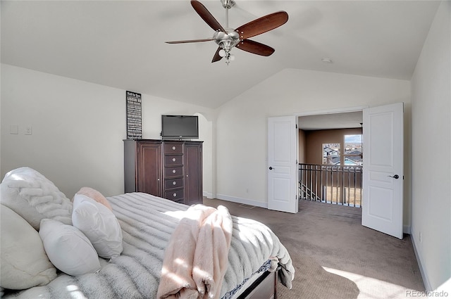 8726 Gardenia Cir, Arvada, CO 80005 - carpeted bedroom with vaulted ceiling, baseboards, and a ceiling fan