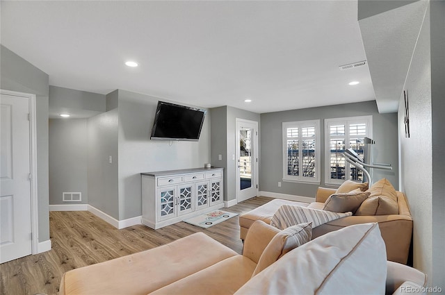 8726 Gardenia Cir, Arvada, CO 80005 - living room featuring light wood-style flooring, baseboards, and recessed lighting