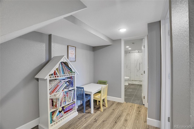 8726 Gardenia Cir, Arvada, CO 80005 - playroom with wood finished floors, baseboards, and recessed lighting