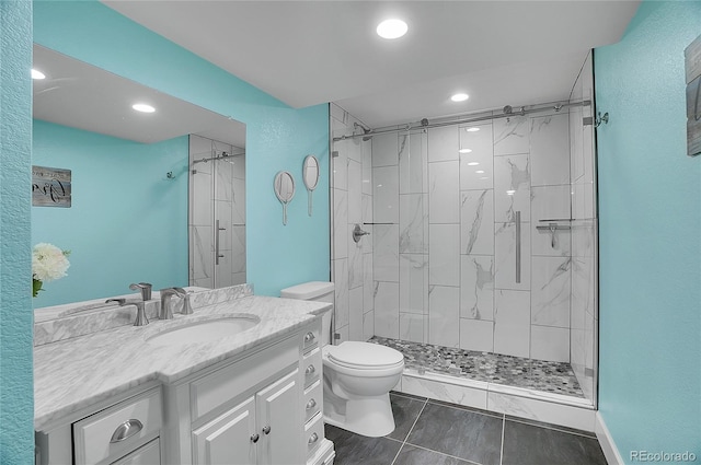 8726 Gardenia Cir, Arvada, CO 80005 - full bath with toilet, vanity, a shower stall, recessed lighting, and tile patterned floors