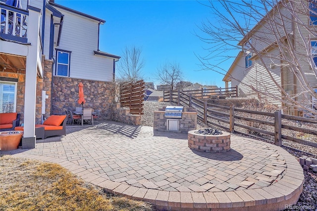 8726 Gardenia Cir, Arvada, CO 80005 - view of patio / terrace with an outdoor living space with a fire pit