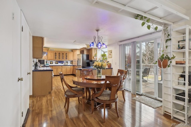 dining space featuring light wood-style flooring