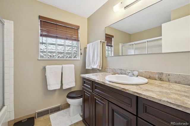 bathroom with visible vents, toilet, tile patterned flooring, baseboards, and vanity