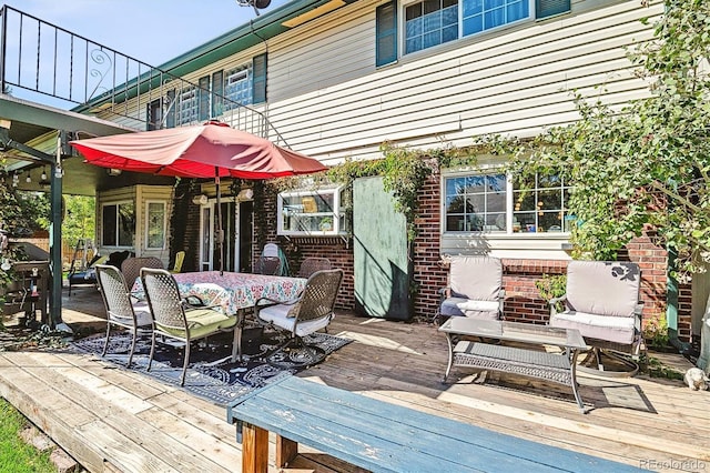 wooden deck with outdoor dining area