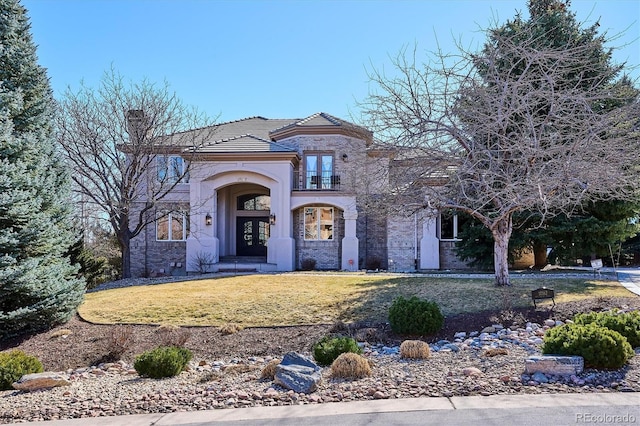 view of front facade featuring french doors, a chimney, and a front yard