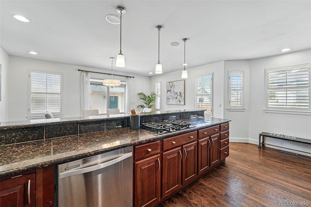 kitchen featuring stainless steel dishwasher, black gas cooktop, dark wood finished floors, plenty of natural light, and recessed lighting