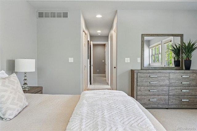 carpeted bedroom featuring recessed lighting