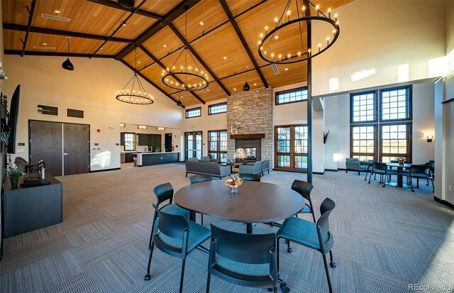 8628 Hotchkiss St, Littleton, CO 80125 - dining room with high vaulted ceiling, wooden ceiling, carpet floors, a chandelier, and plenty of natural light